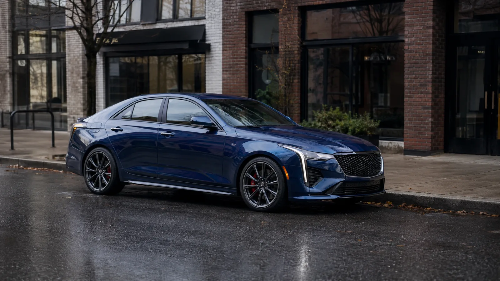 Cadillac CT4 parked at a city kerb in overcast light, front three-quarter view - Cadillac CT4