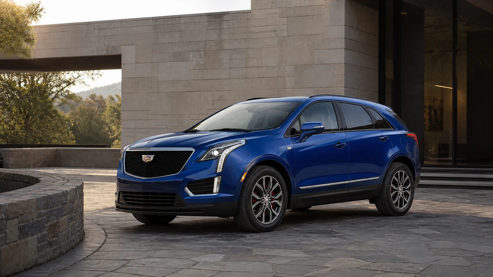 2026 Cadillac XT5 turning into a stone-lined museum arrival court