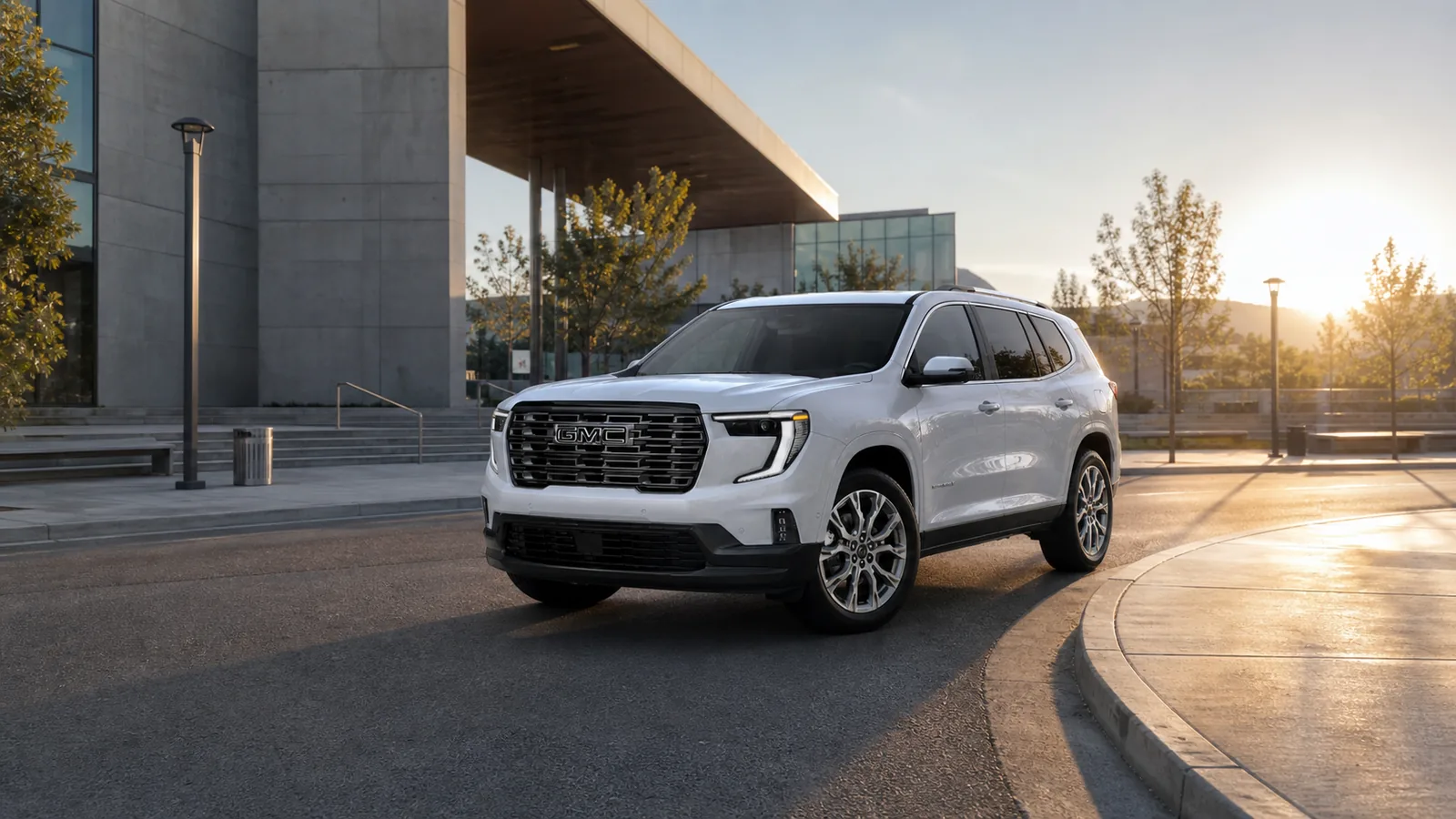 2026 GMC Acadia arriving at a modern civic plaza - GMC Acadia