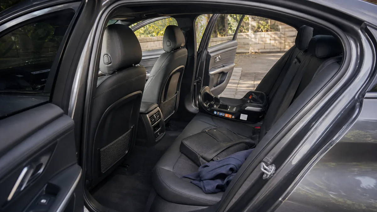 Compact sport sedan rear seat with daily gear