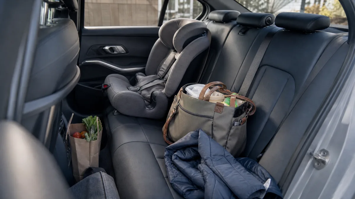 Compact sport sedan rear seat with daily gear