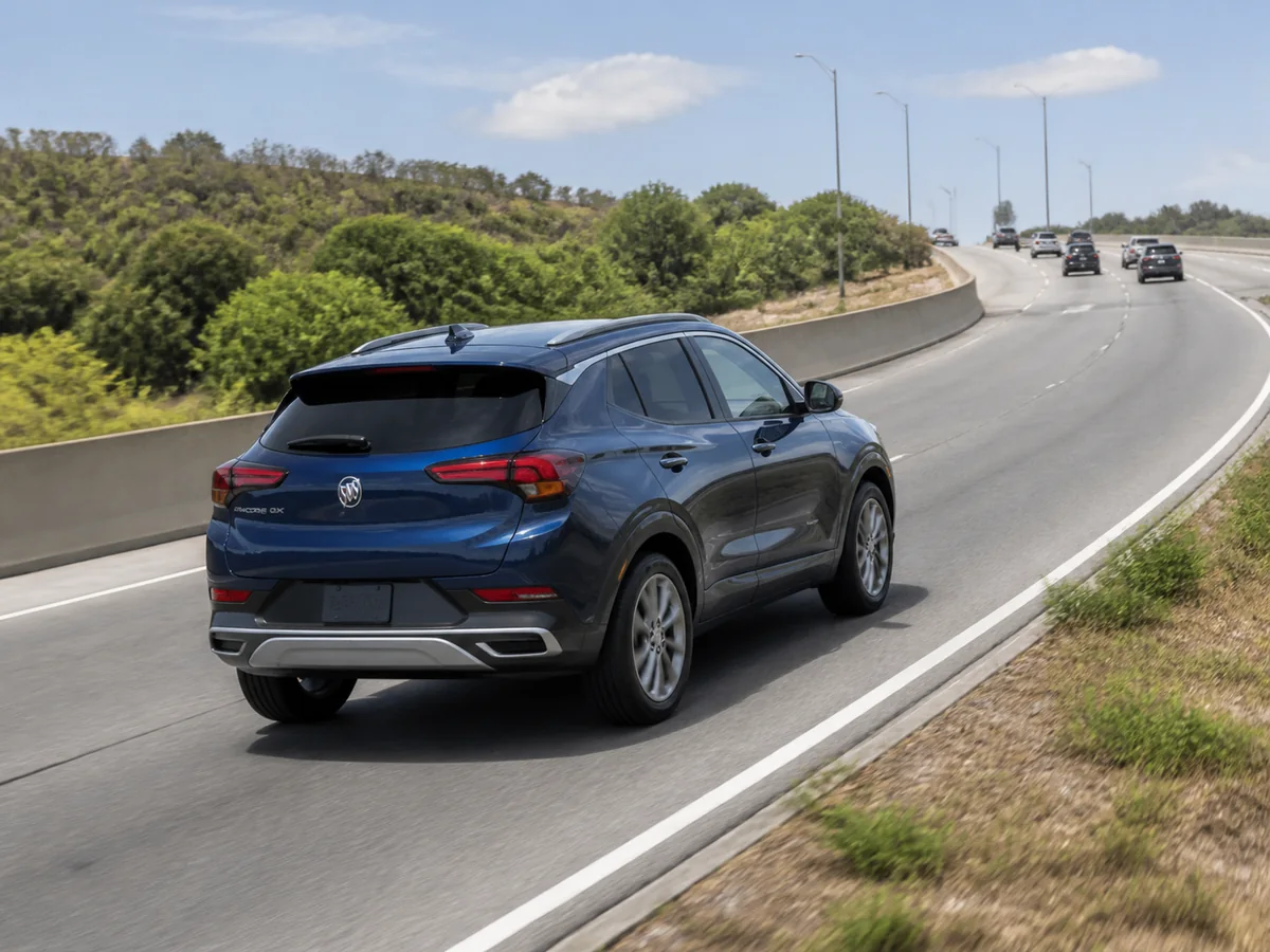 Current Buick Encore GX accelerating on an uphill suburban highway ramp - Buick Encore GX