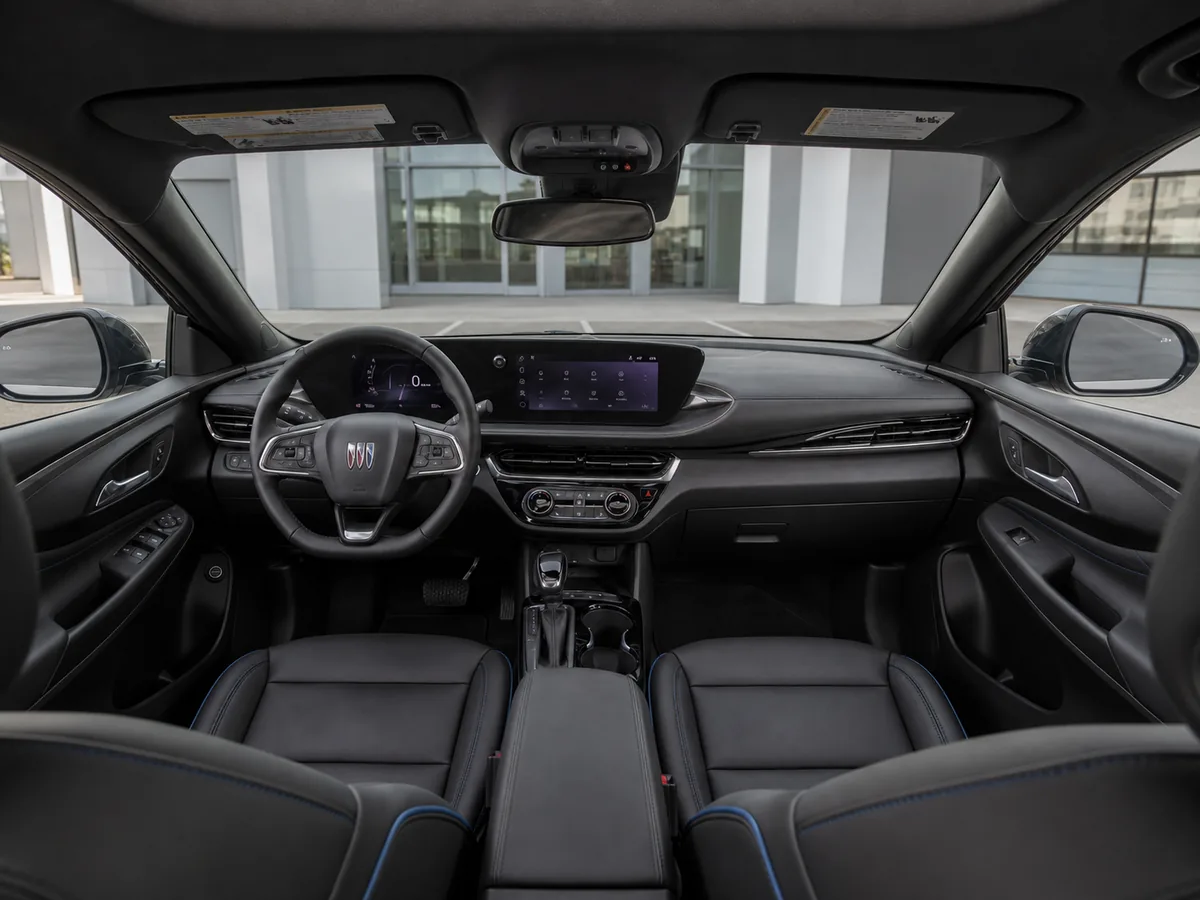Wide view of the current Buick Envista dashboard, displays, controls, front seats, and door trim - Buick Envista
