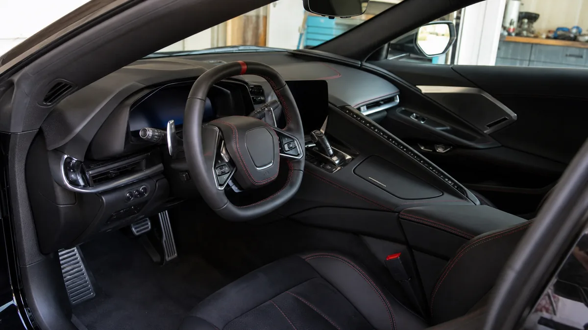 Performance coupe cockpit and driving controls