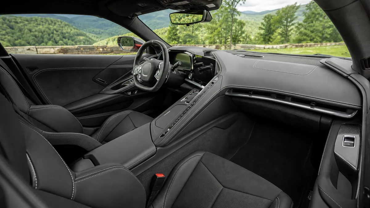 Performance coupe cockpit and driving controls