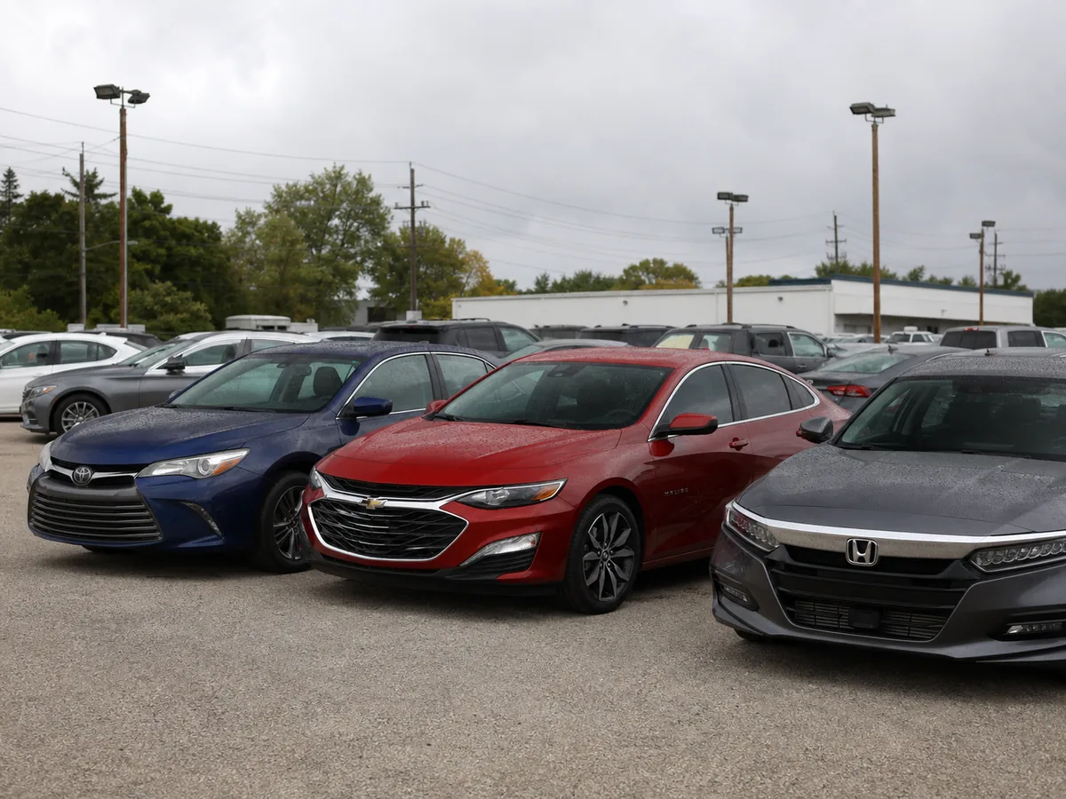 Final-generation Chevrolet Malibu beside newer midsize sedans - Chevrolet Malibu