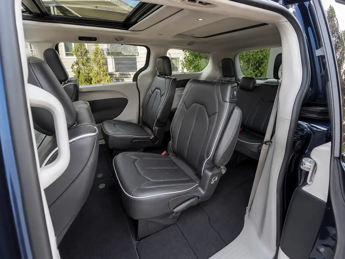 Sliding-door view of a 2026 gas Chrysler Pacifica with all three seating rows upright - Chrysler Pacifica