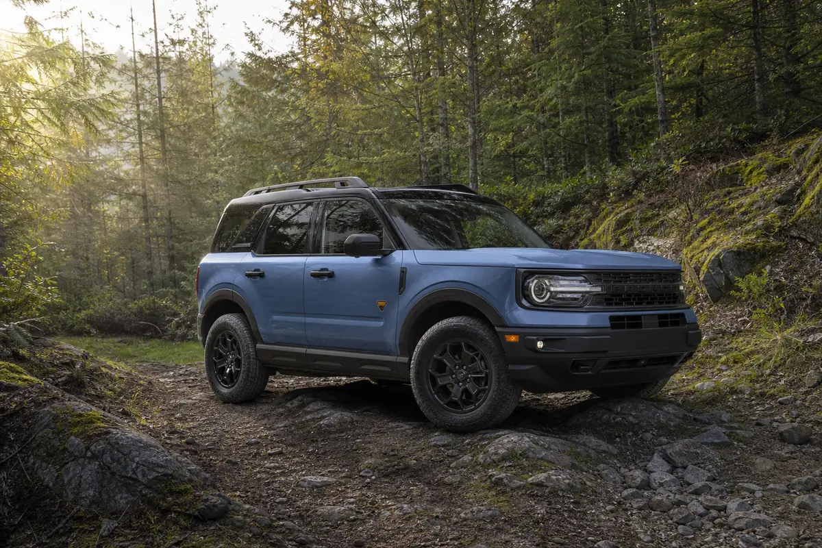 Ford Bronco Sport Badlands positioned on uneven trail terrain with the wheels and ground clearance visible