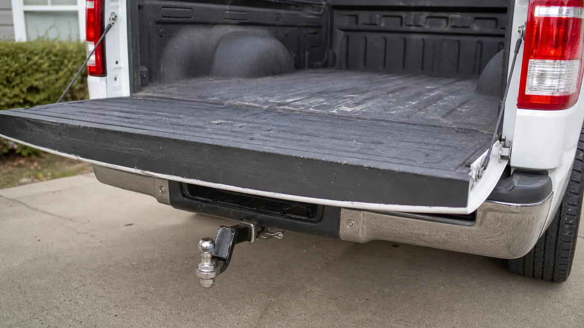 Pickup truck receiving engine and transmission inspection in a service bay - Ford F-150
