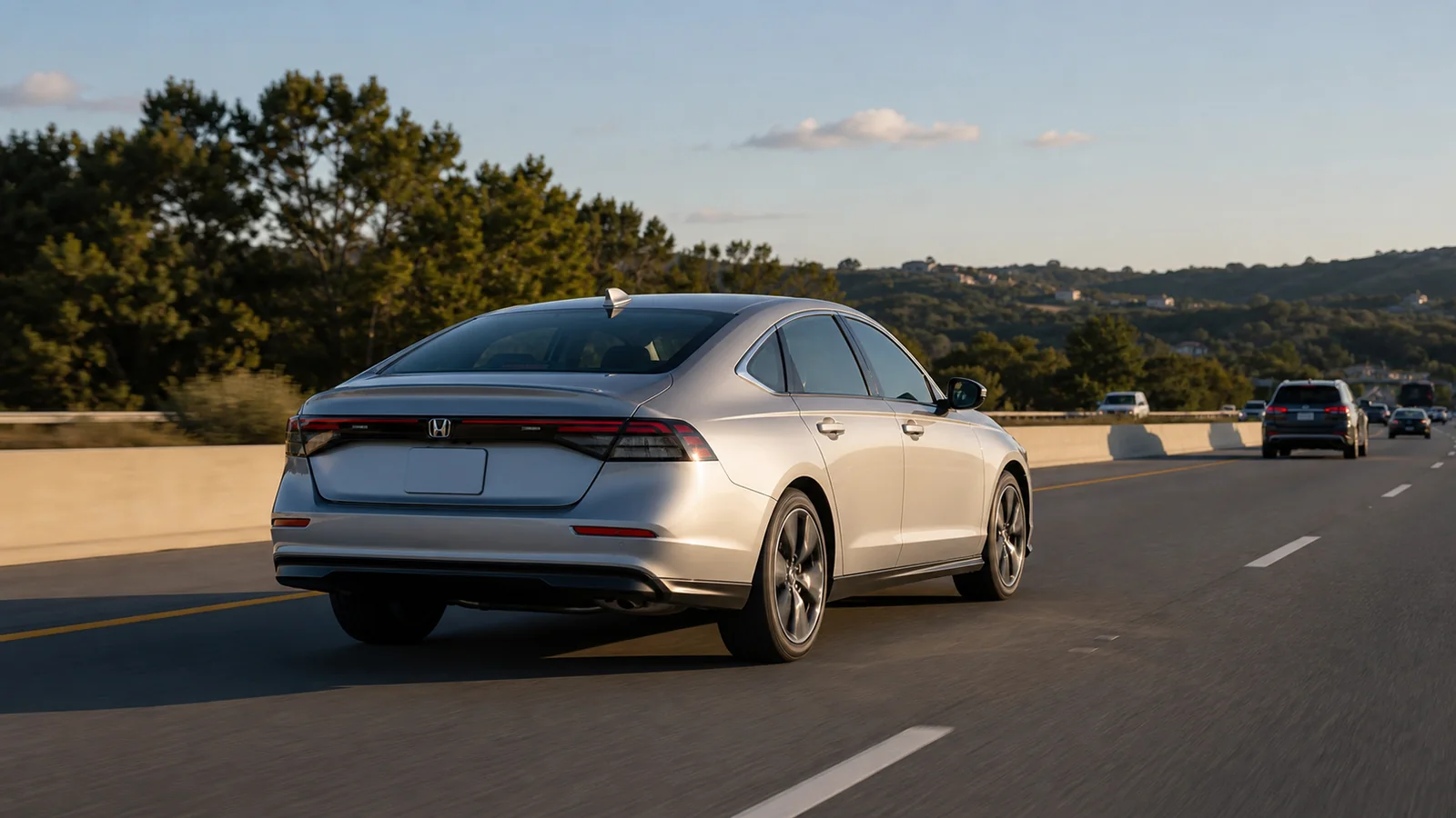 Silver Honda Accord viewed from behind during a normal highway trip