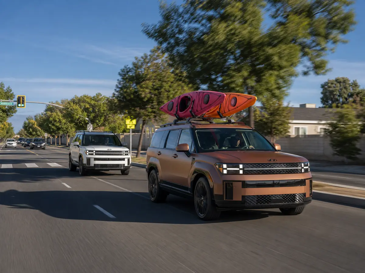 Gas and hybrid Hyundai Santa Fe models on a family test route