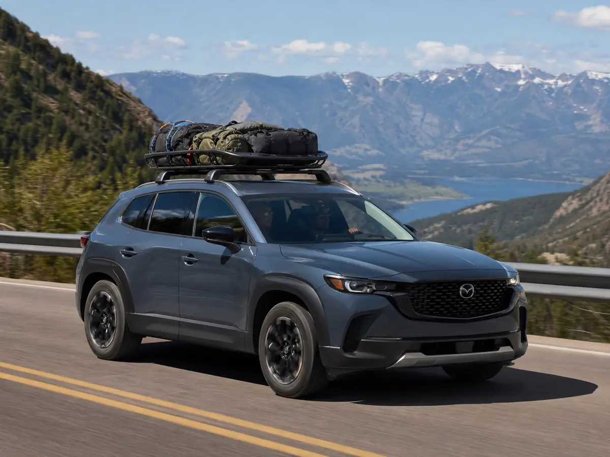 Base-engine Mazda CX-50 carrying passengers on a highway grade