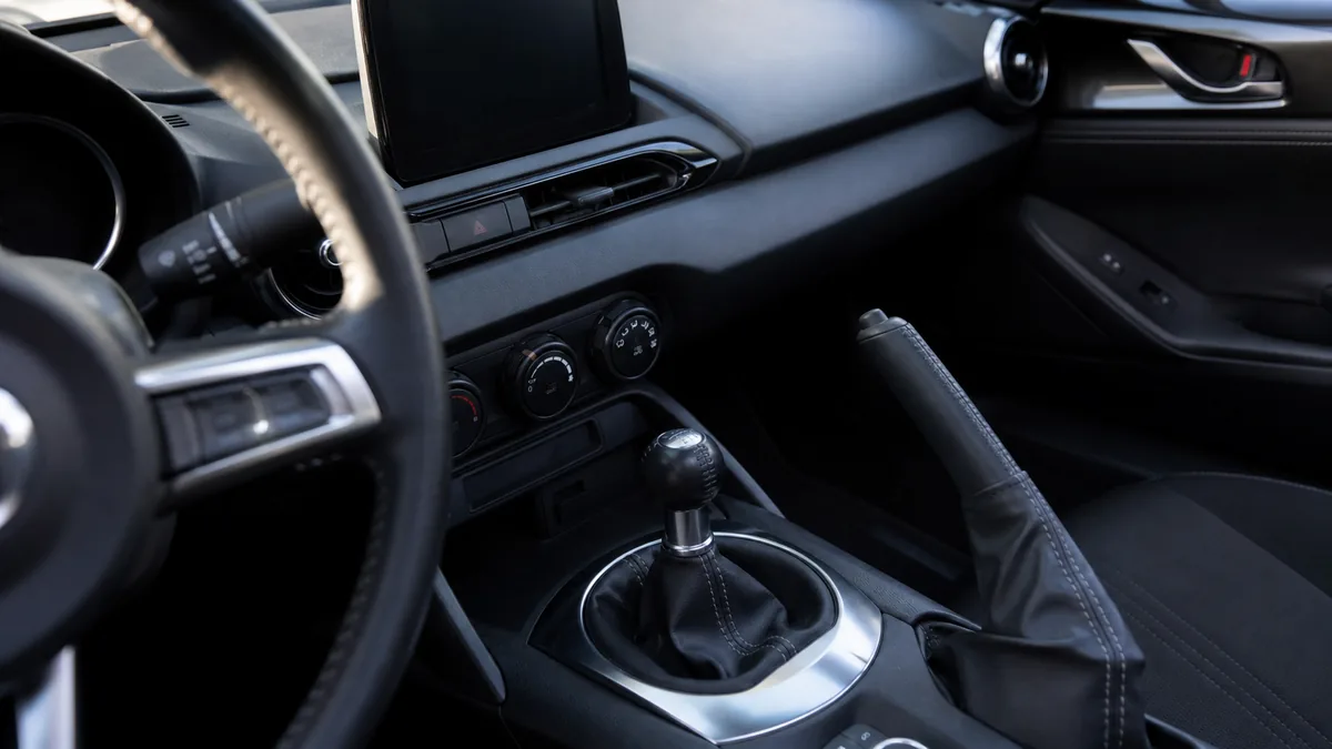 Manual shifter and compact roadster cabin detail
