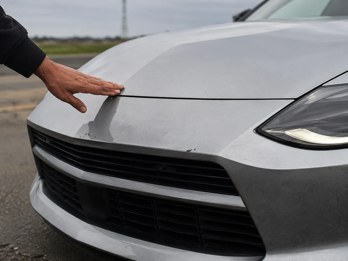 Close view of the front bumper and bonnet shut line on a Nissan Z during a pre-purchase inspection - Nissan Z