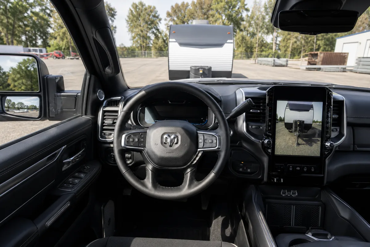 2027 Ram 2500 driver view of trailer camera display and physical tow controls