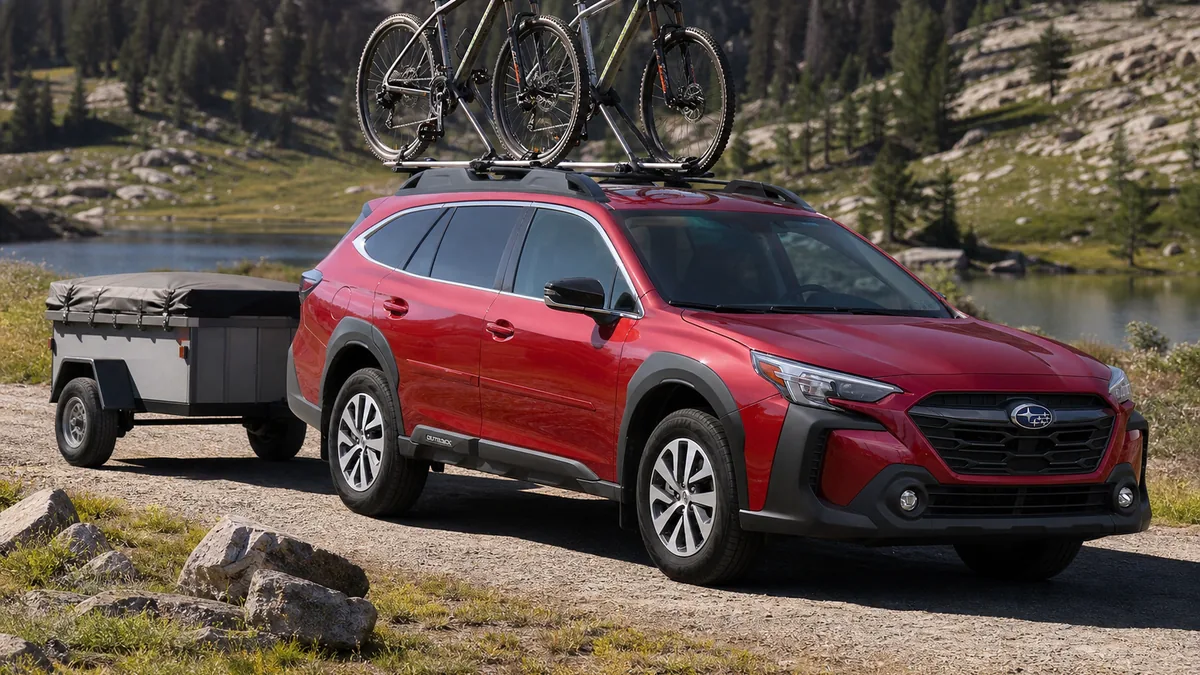 Subaru Outback with small trailer and bikes