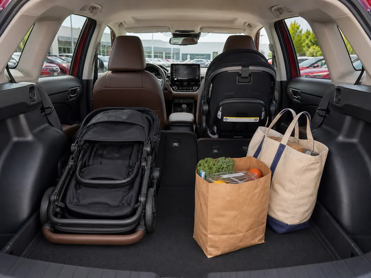2026 Toyota Corolla Cross cargo area loaded with a stroller and weekly bags - Toyota Corolla Cross