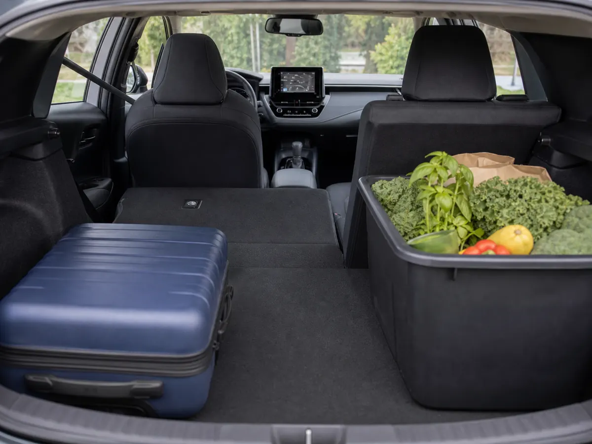 2026 Toyota Corolla Hybrid rear cabin and open trunk prepared for a family fit test - Toyota Corolla Hybrid
