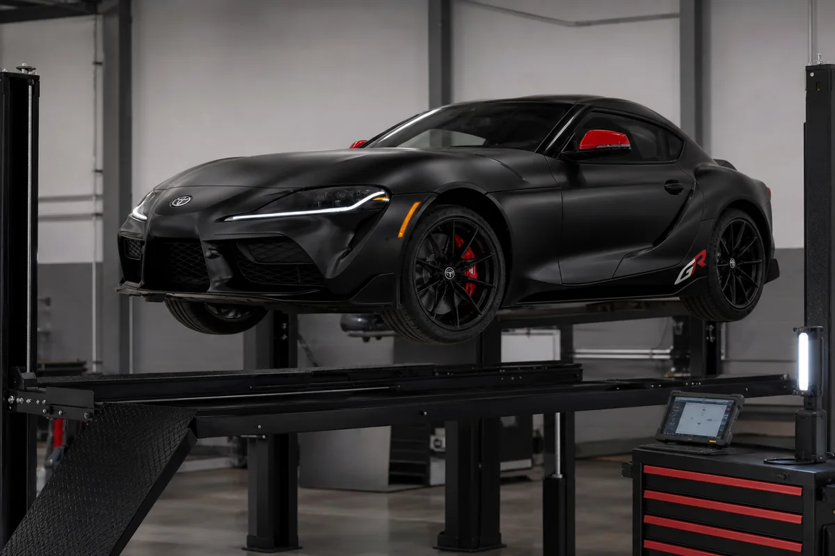 2026 Toyota GR Supra on a workshop lift for tire, brake, underbody, and diagnostic inspection - Toyota GR Supra