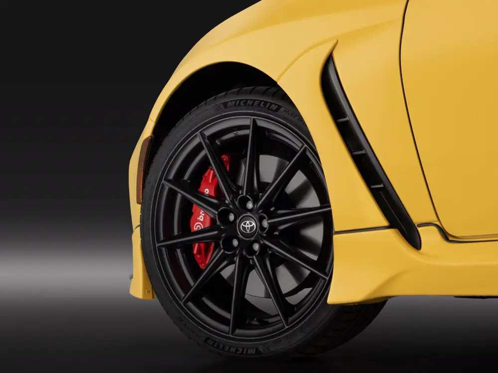 Official 2026 Toyota GR86 Yuzu Edition wheel, tire, and Brembo brake close-up - Toyota GR86