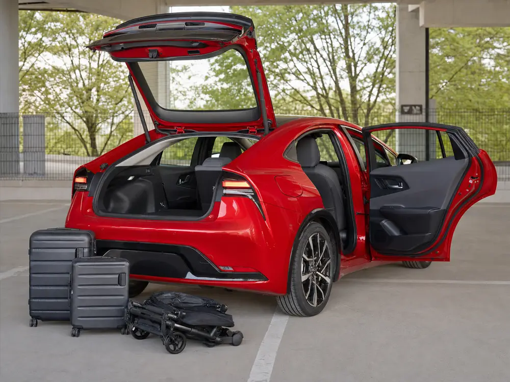 2024 Toyota Prius Prime rear cabin and open hatch prepared for a passenger and cargo fit test - Toyota Prius Prime