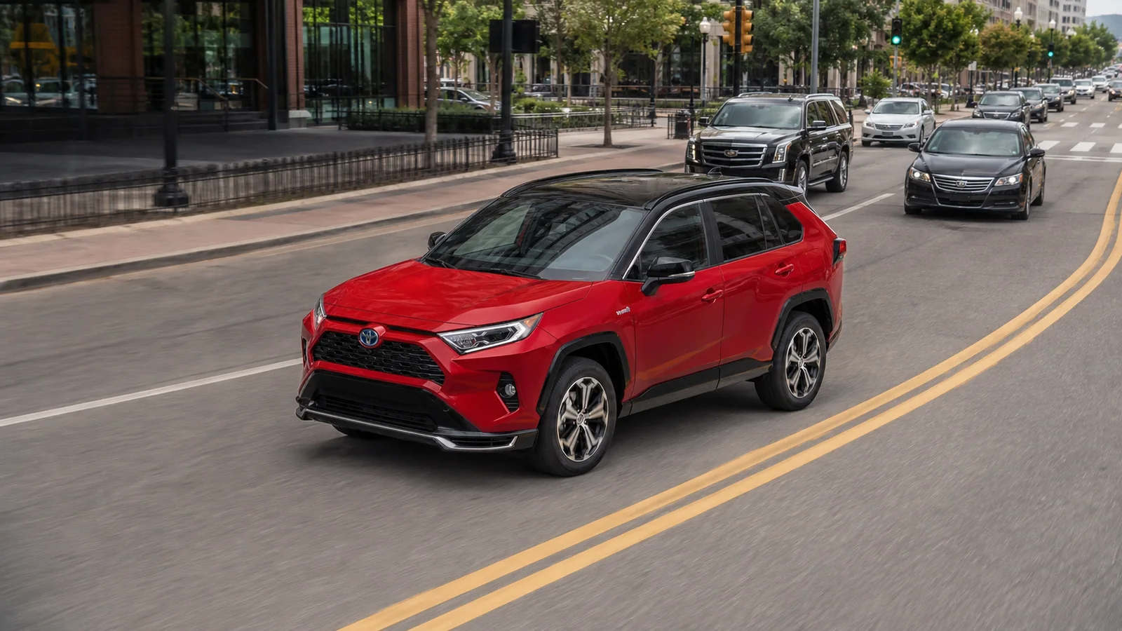Red Toyota RAV4 Hybrid moving through ordinary city traffic